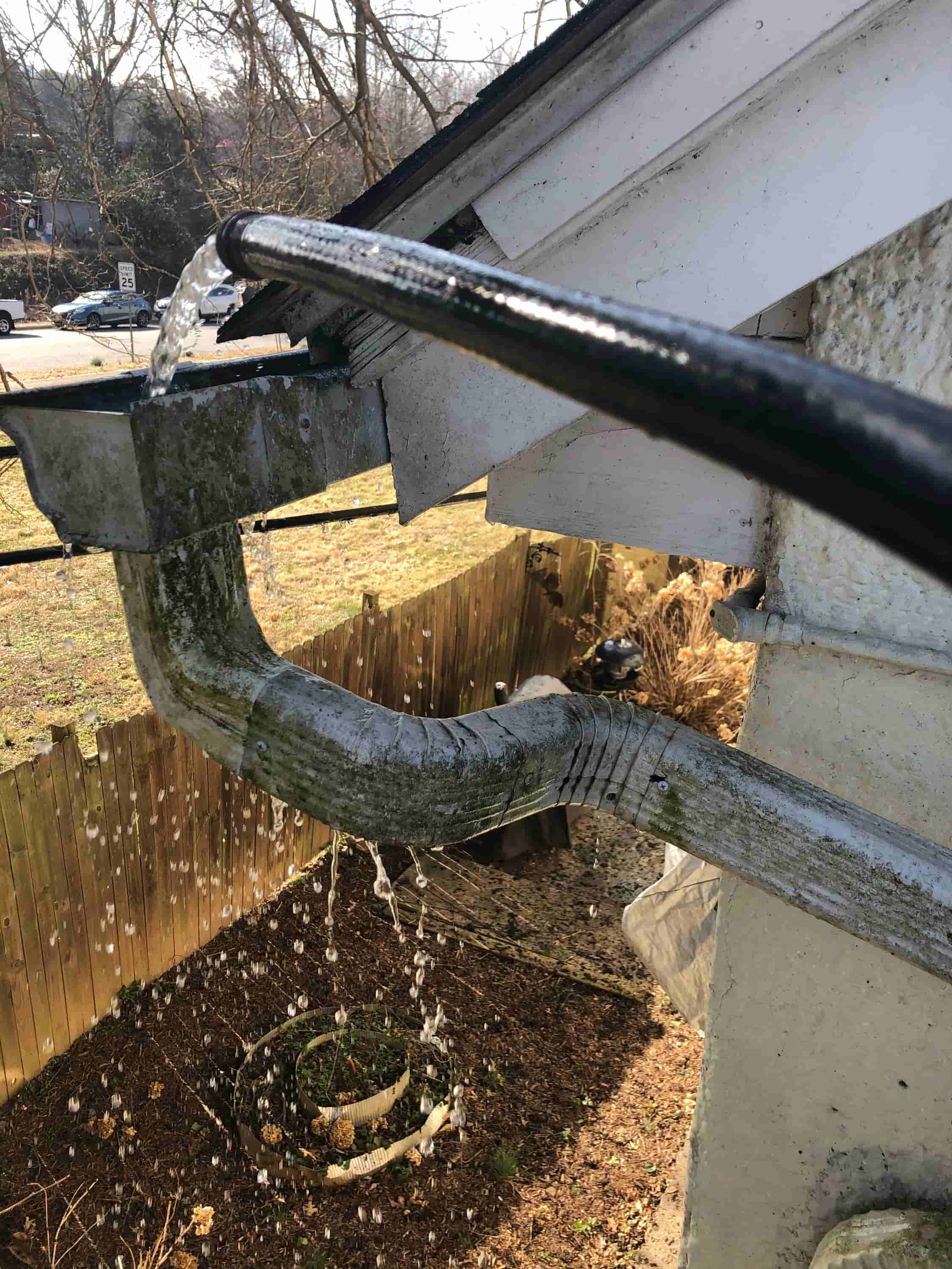 cleaning gutter downspouts