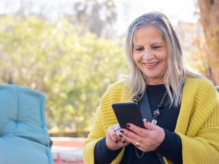 Senior-age woman signing up for paid AI research with participantOS