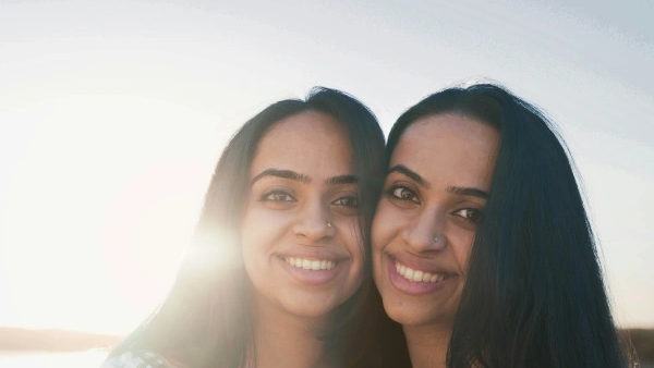 Twin South Asian Women smiling