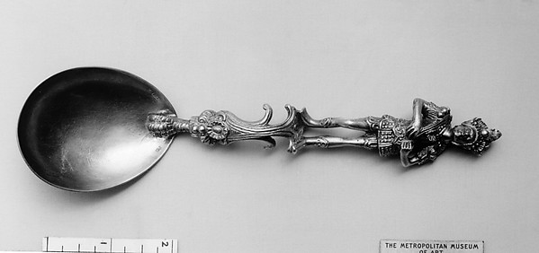 Figure-top spoon