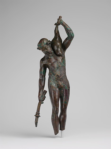 Bronze statuette of a satyr with a torch and wineskin