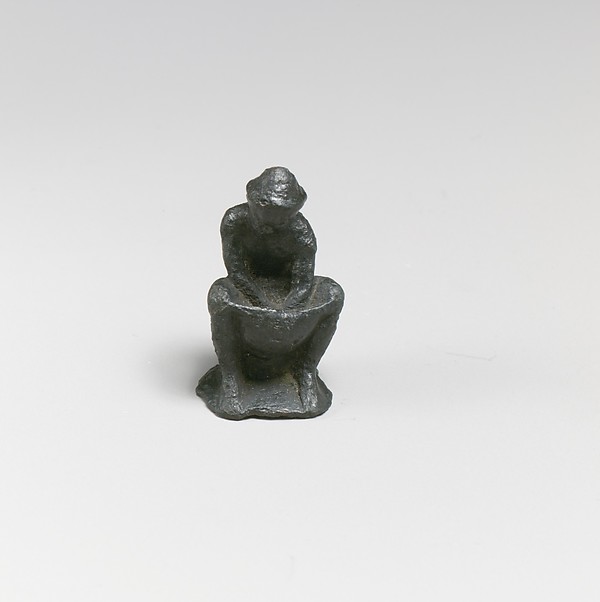 Bronze statuette of a man working