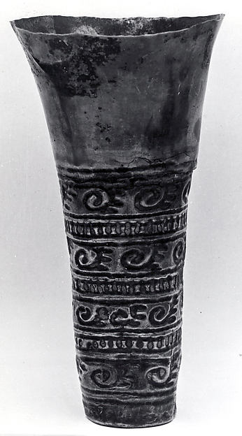 Beaker with scroll ornamentation