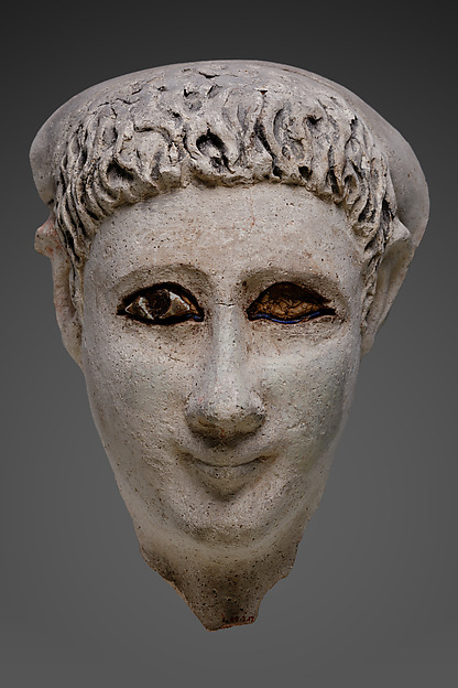Mask of a man with loose hair combed forward and a mantle