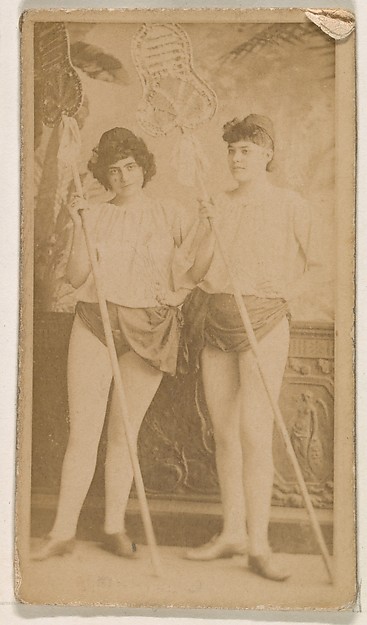 Two actresses holding long poles, from the Actresses series (N245) issued by Kinney Brothers to promote Sweet Caporal Cigarettes