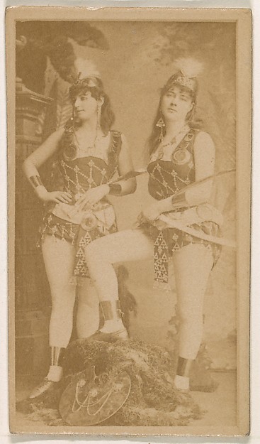 Two actresses, one holding sword, from the Actresses series (N245) issued by Kinney Brothers to promote Sweet Caporal Cigarettes