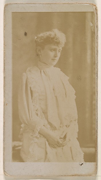 Actress in profile dressed in white gown, from the Actresses series (N245) issued by Kinney Brothers to promote Sweet Caporal Cigarettes