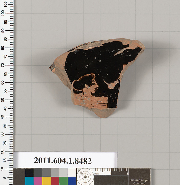 Terracotta fragment of a stemless kylix (drinking cup)