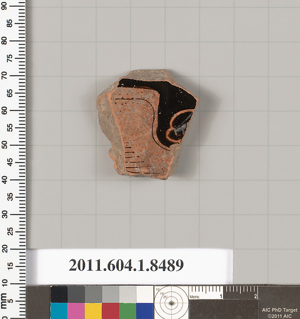 Terracotta fragment of a stemless kylix (drinking cup)