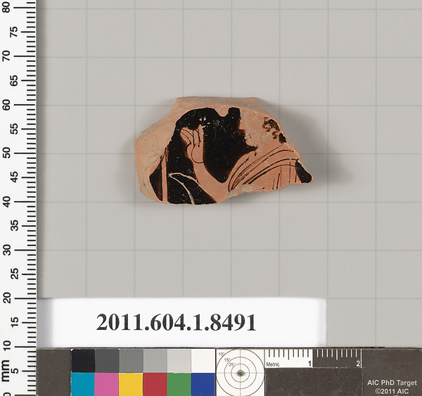 Terracotta fragment of a stemless kylix (drinking cup)