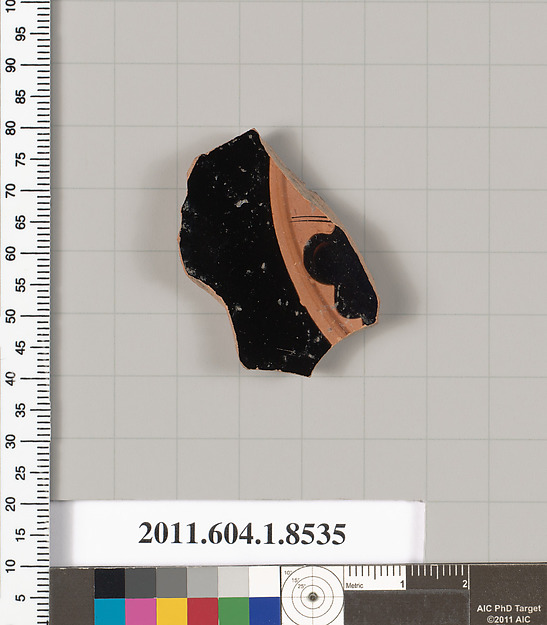 Terracotta fragment of a stemless kylix (drinking cup)