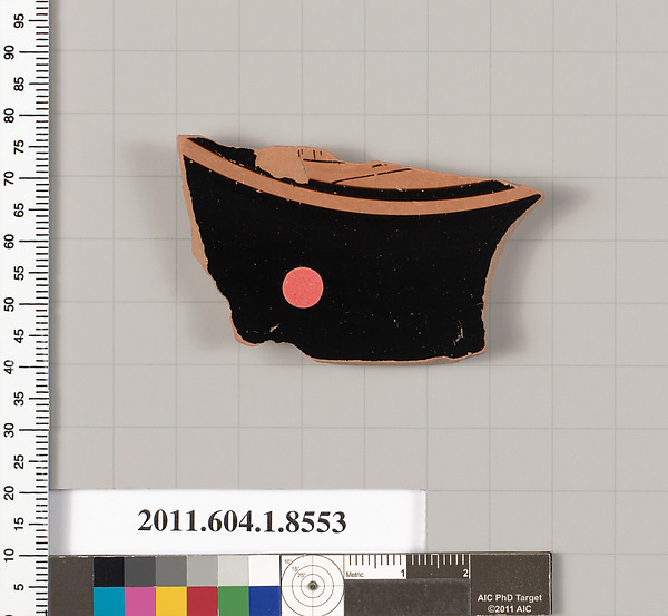 Terracotta fragment of a stemless kylix (drinking cup)