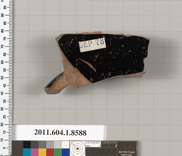 Terracotta fragment of a stemless kylix (drinking cup)