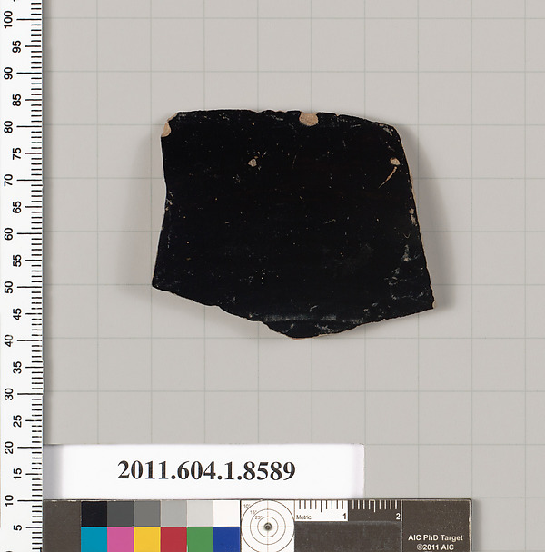 Terracotta fragment of a stemless kylix (drinking cup)