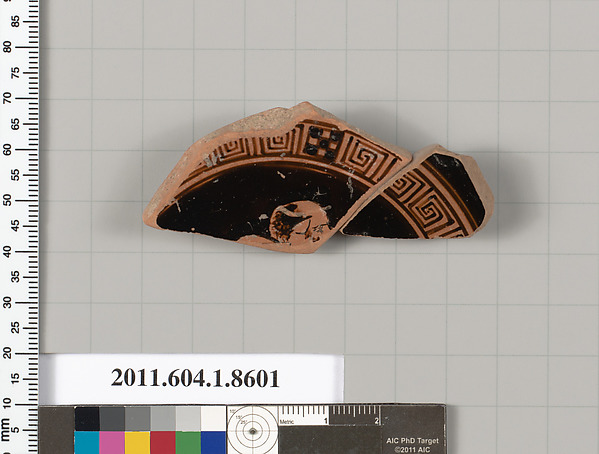 Terracotta fragment of a stemless kylix (drinking cup)