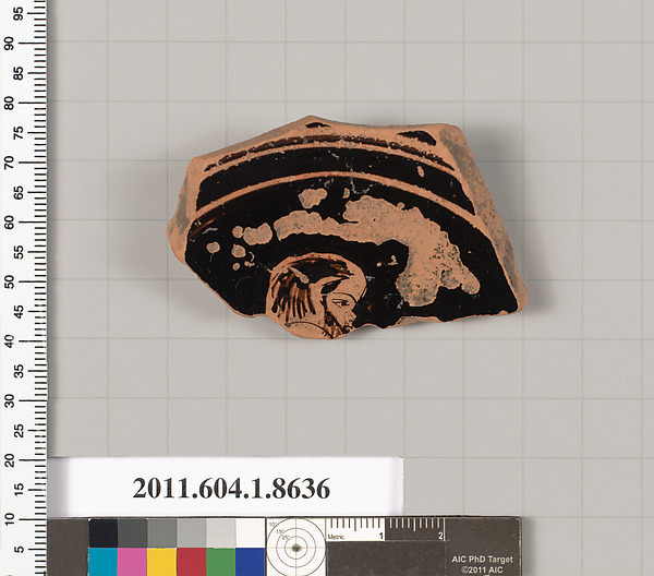 Terracotta fragment of a stemless kylix (drinking cup)