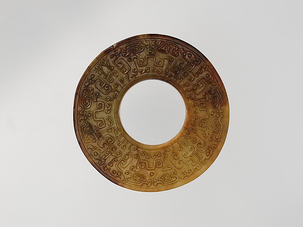 Annular Disk with Carved Designs