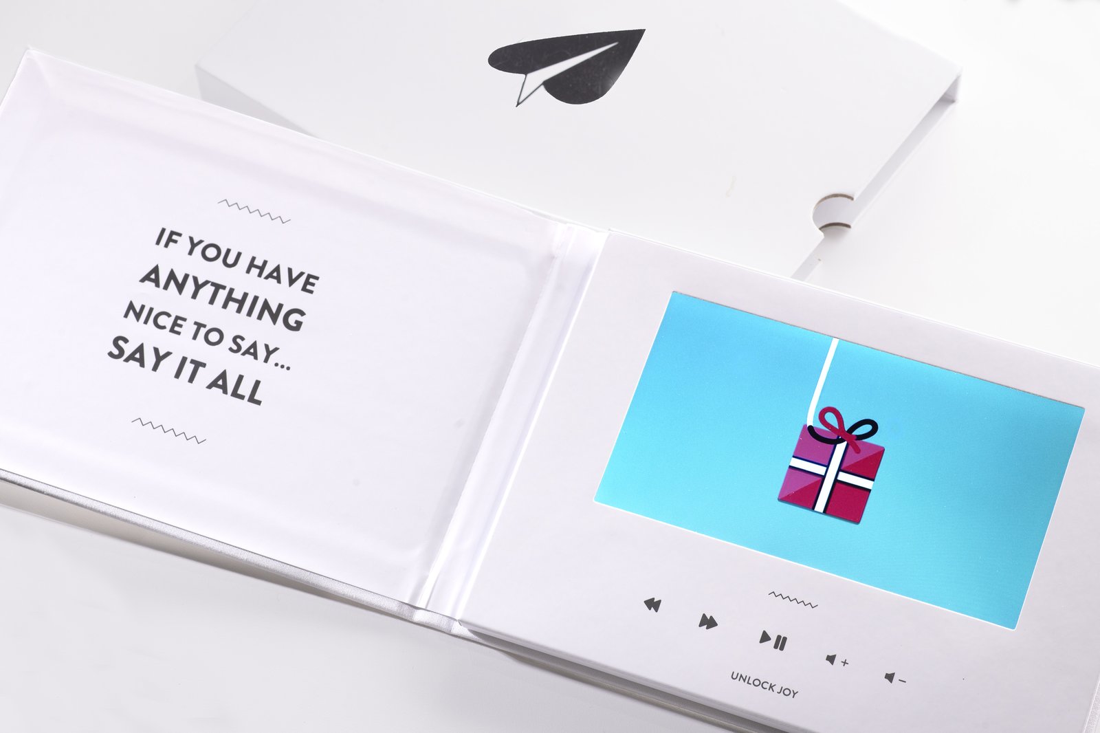 Tribute Video Book — a physical keepsake that plays a personalized video montage
