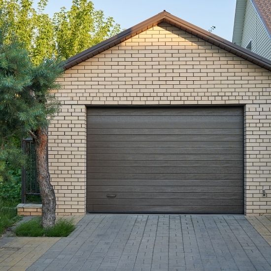 How does weather affect garage door performance?
